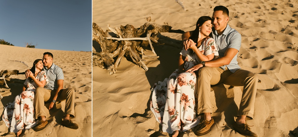 couple hugging at dune at warren dunes state park engagement session
