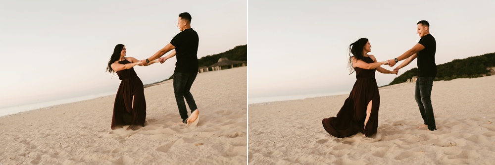 couple dancing on beach at dune at warren dunes state park engagement session