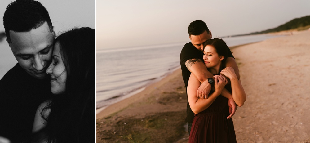 couple hugging on beach at dune at warren dunes state park engagement session