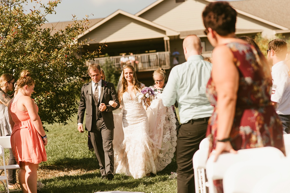 bride and father walking down aisle at metea county park fall wedding