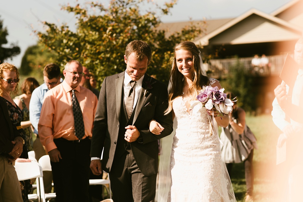 bride and father walking down aisle at metea county park fall wedding