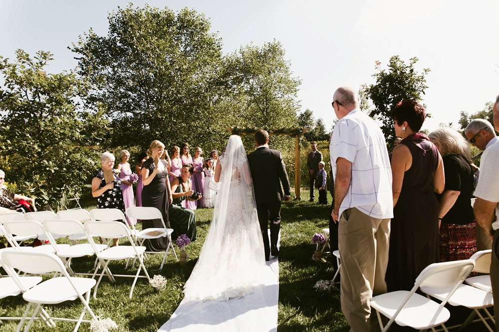 bride walking down aisle at metea county park fall wedding