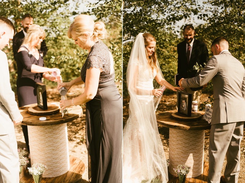 bride and groom filling cups from well at metea county park fall wedding