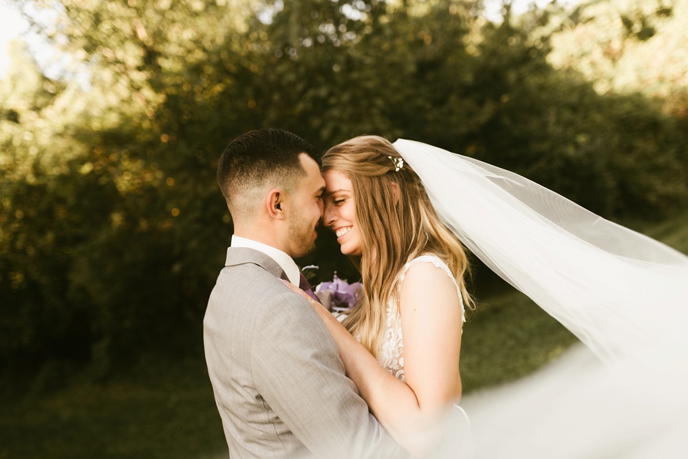 bride and groom smiling at metea county park fall wedding
