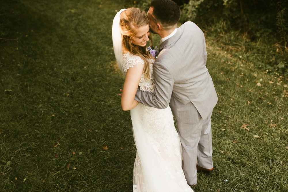 bride and groom hugging at metea county park fall wedding