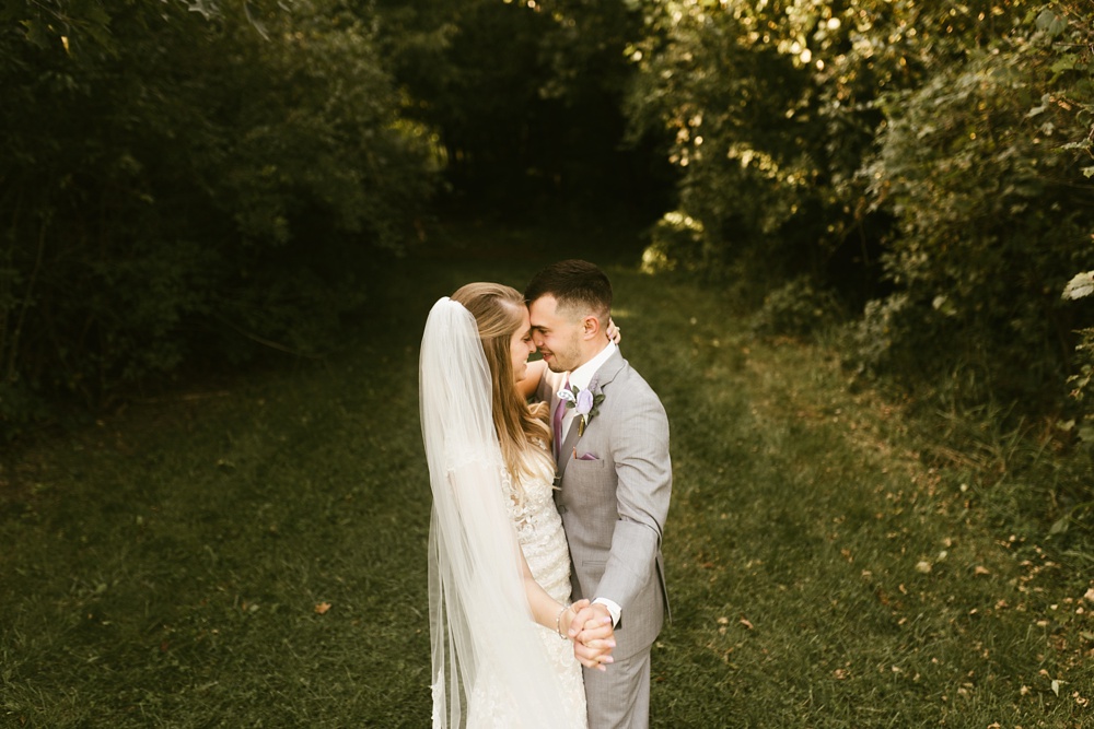 bride and groom hugging at metea county park fall wedding
