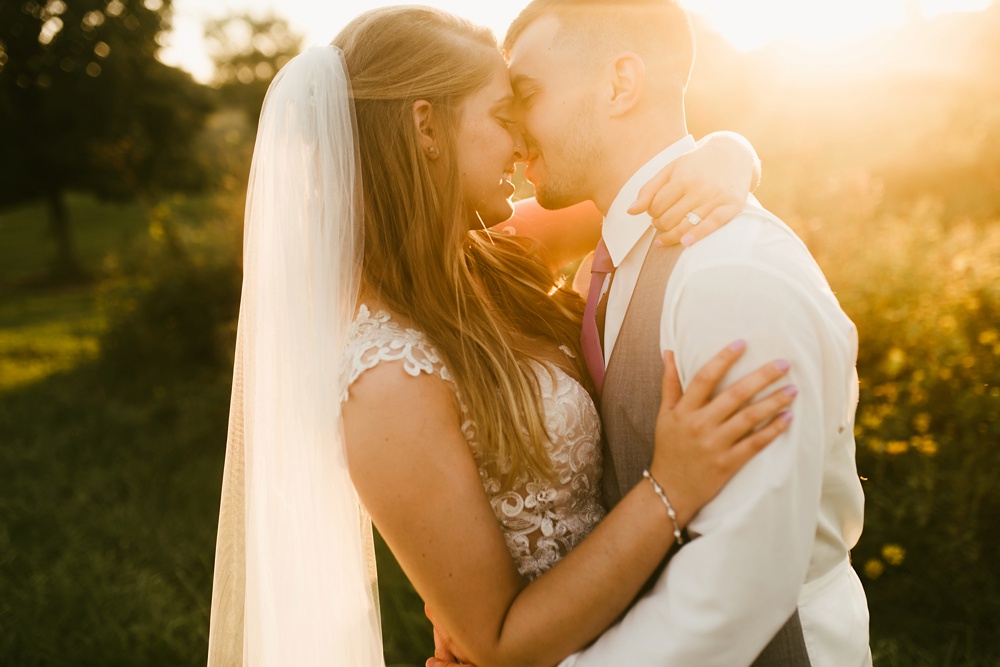 bride and groom kissing at metea county park fall wedding