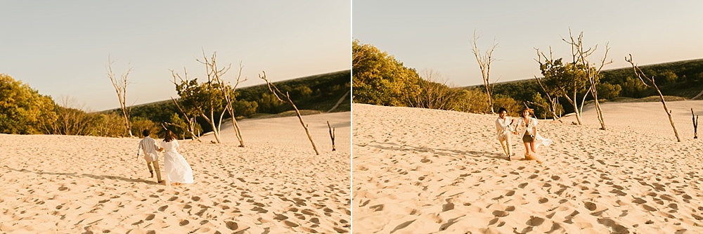 coupel walking along sand dune at warren dunes van life engagement shoot