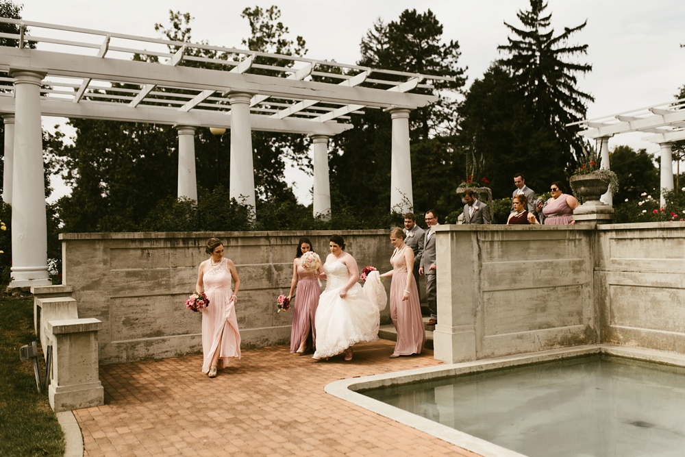 bridesmaids in blush dresses and bride in davids bridal dress at foster park wedding