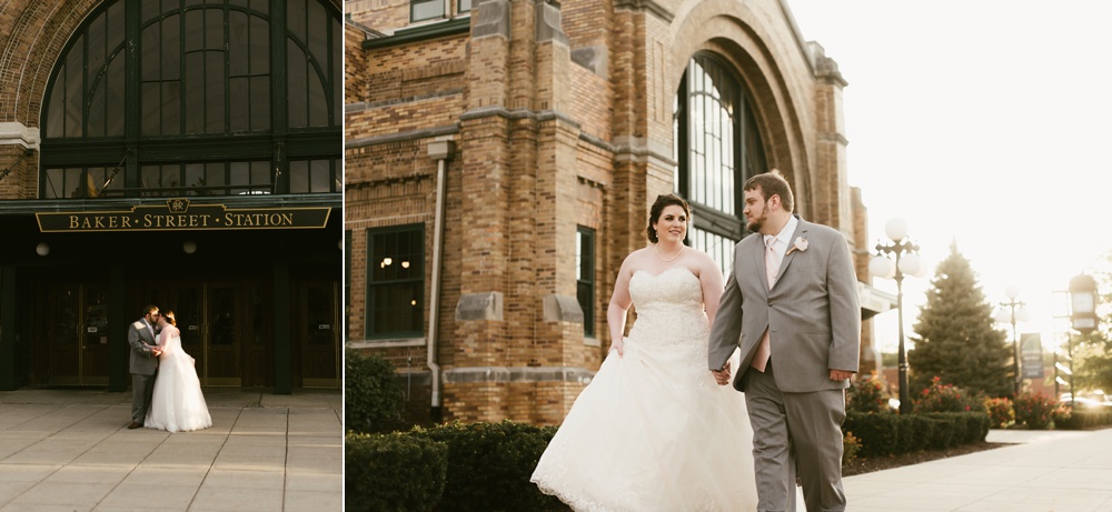 couple holding hands outside of station at baker street train station wedding