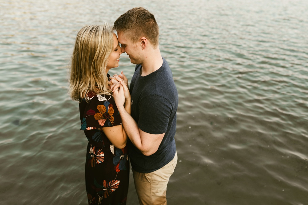 couple standing in water at france park engagement session