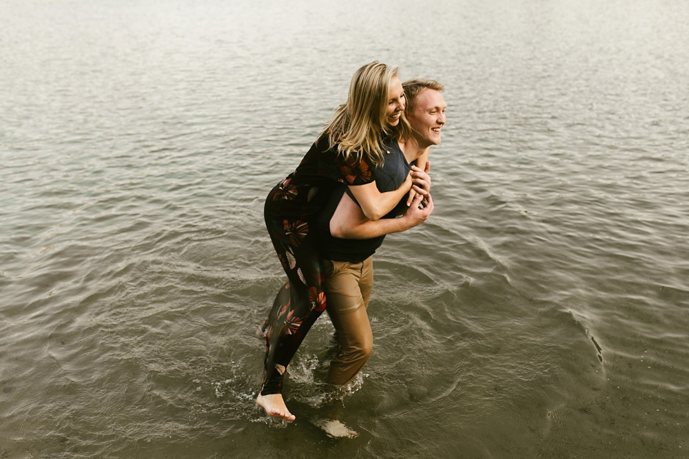 coupld walking through water at france park engagement session