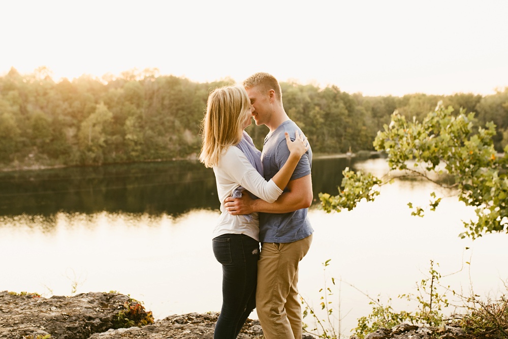 couple kissing next to pond at france park engagement session