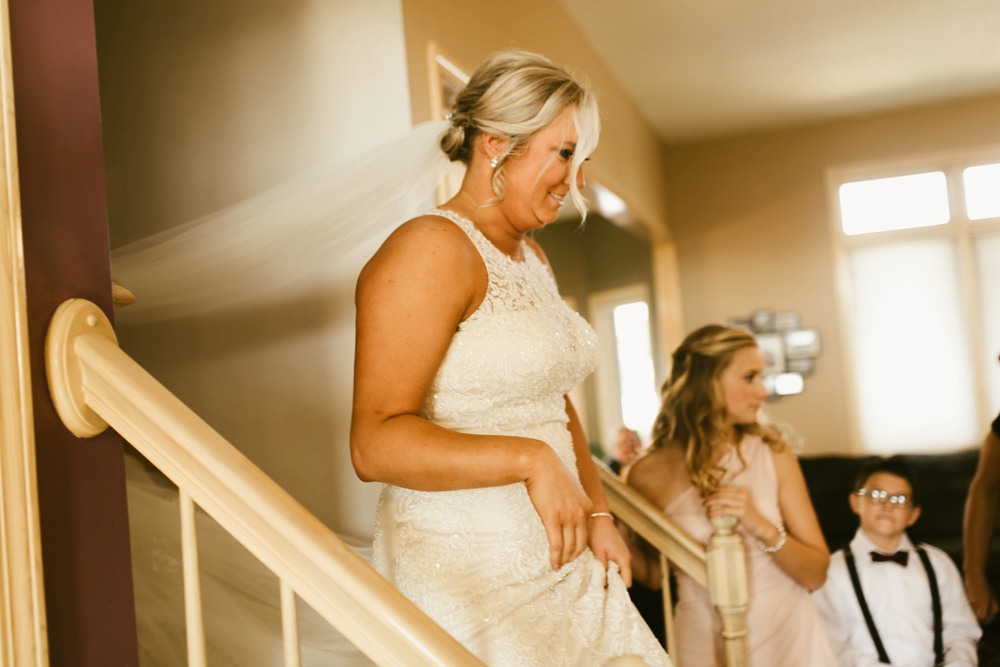 bride walking down stairs at purdue fort wayne international ballroom wedding