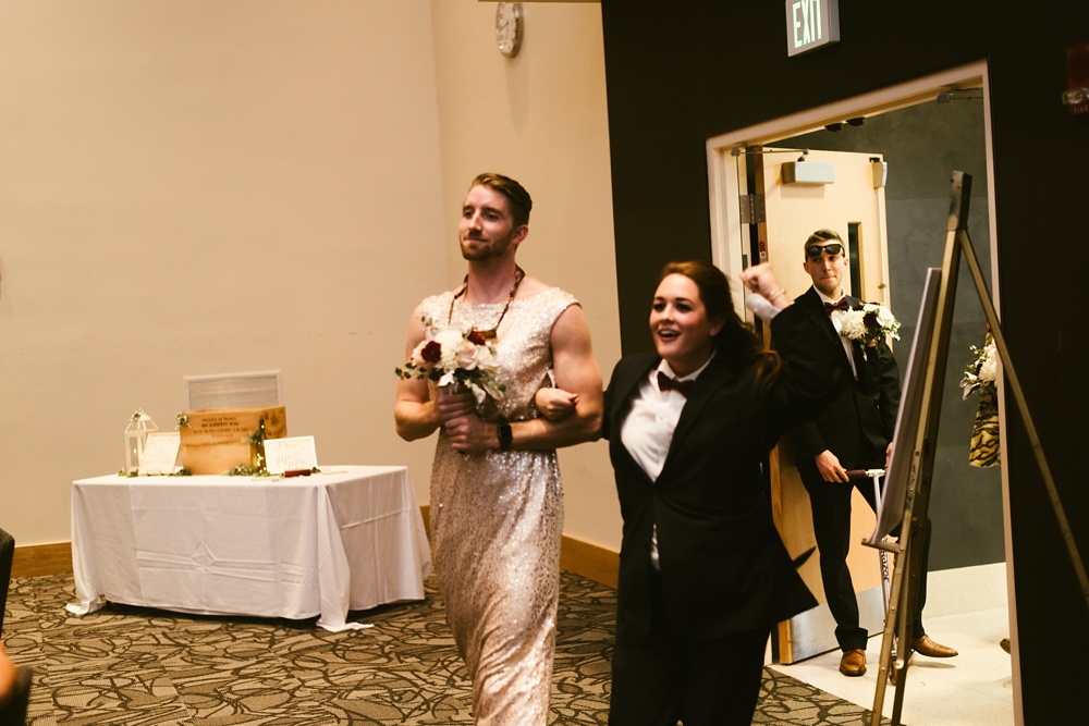 bridal party entering in switched outfits at purdue fort wayne international ballroom wedding