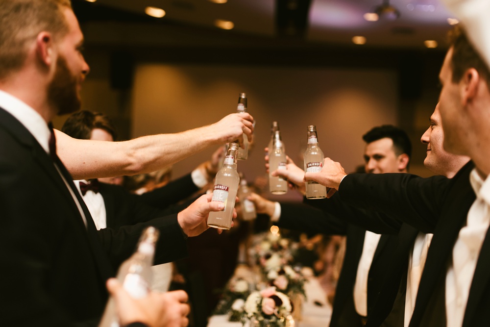 groomsmen cheersing at purdue fort wayne international ballroom wedding