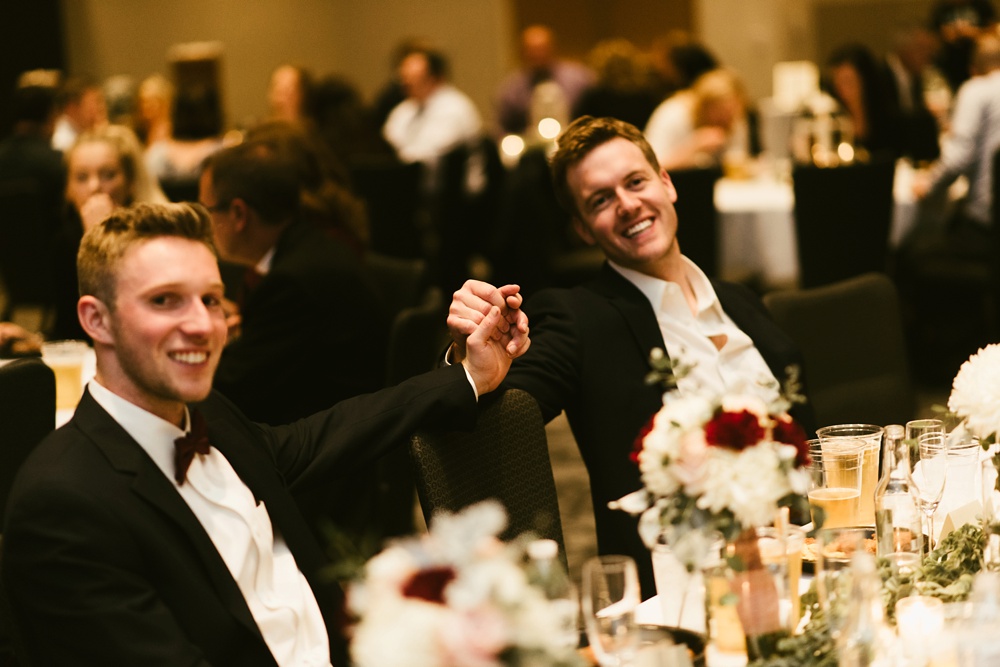groomsmen laughing at purdue fort wayne international ballroom wedding