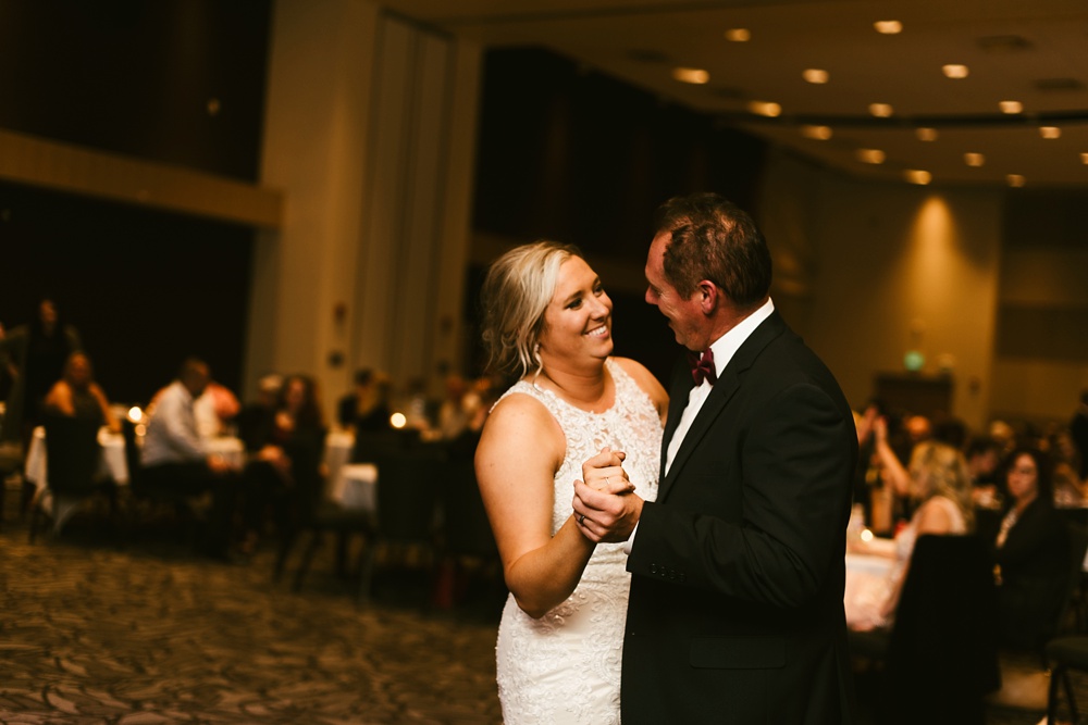 bride laughing with father at purdue fort wayne international ballroom wedding