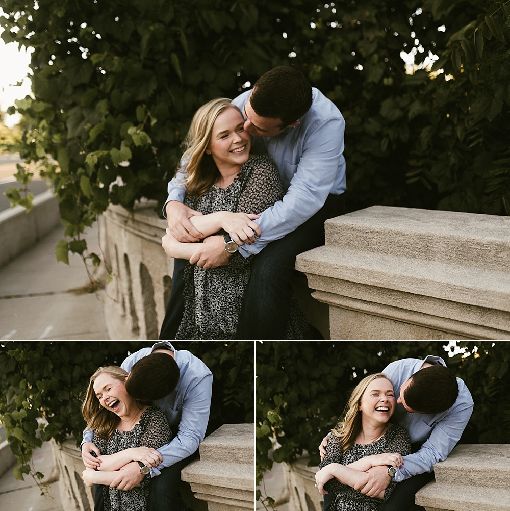 couple kissing on bridge at downtown south bend engagement session