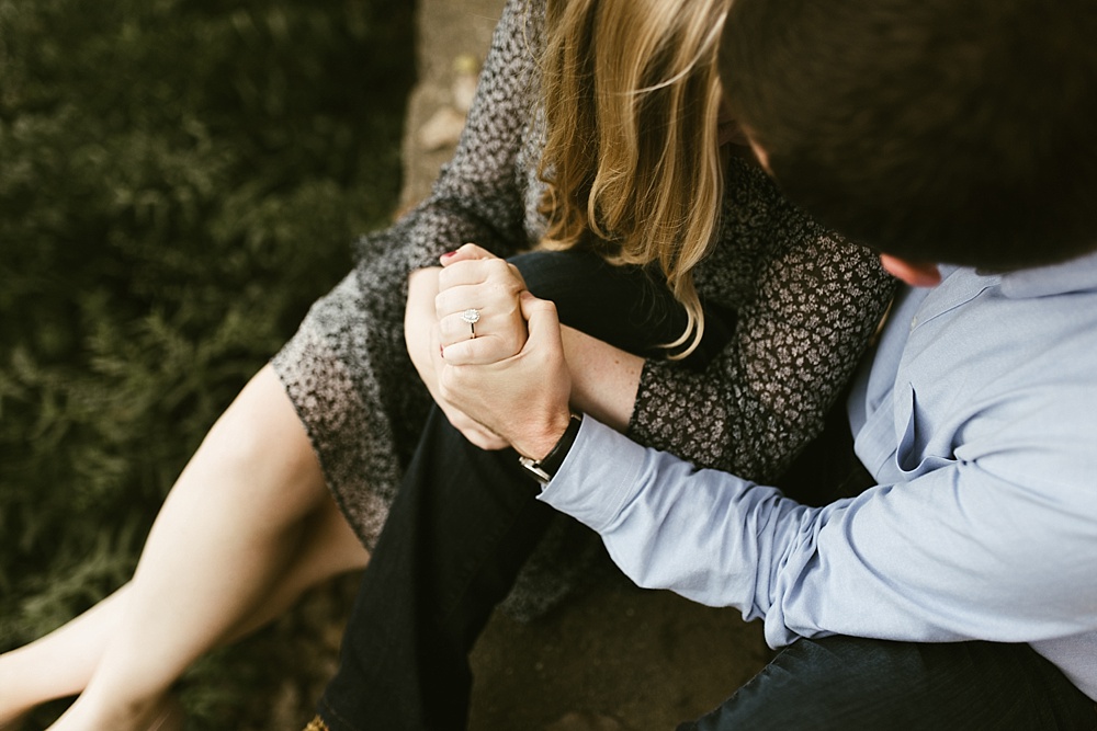 couple holding hands at downtown south bend engagement session