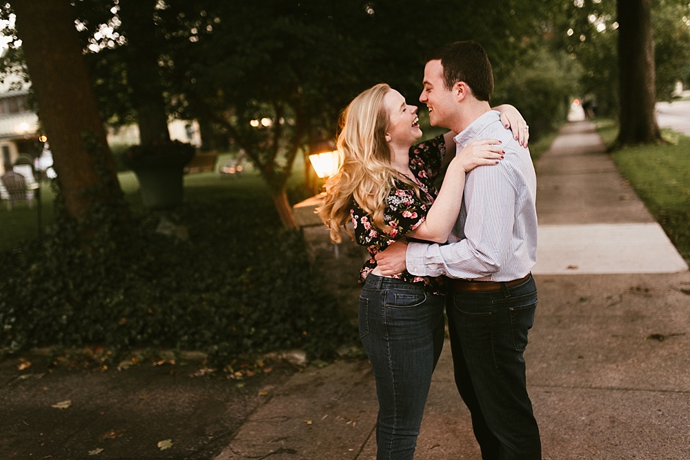 couple laughing together at downtown south bend engagement session