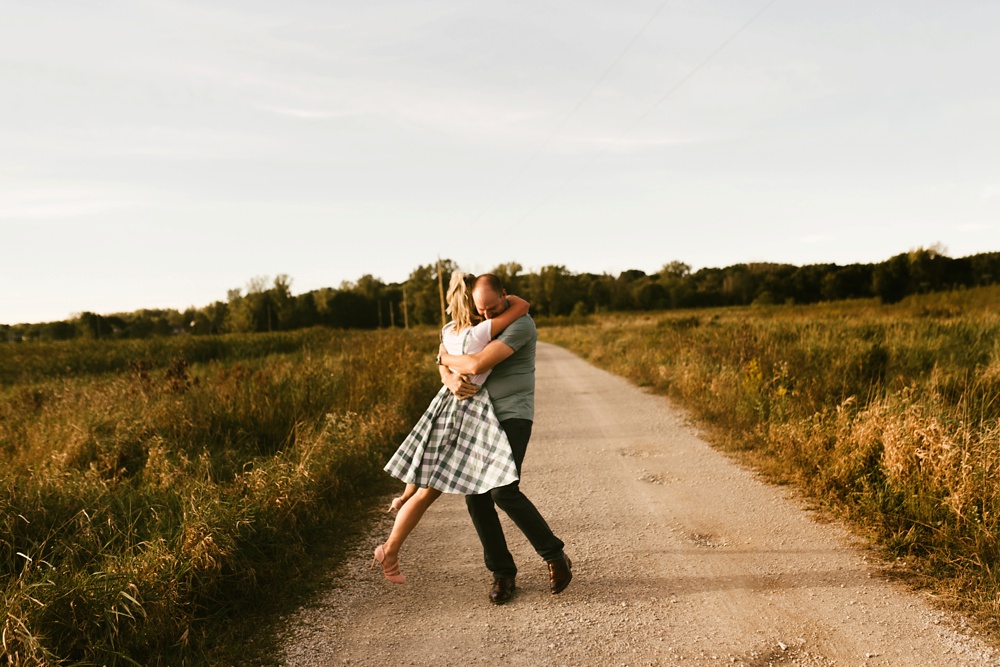 couple dancing by field at eagle marsh nature preserve engagement session