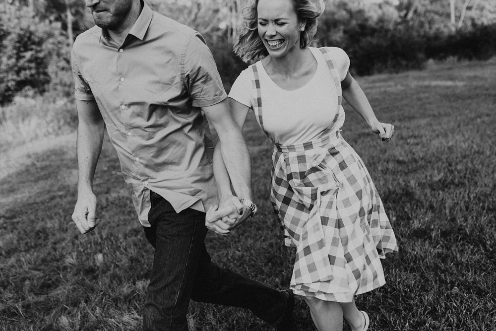 couple holding hands at eagle marsh nature preserve engagement session