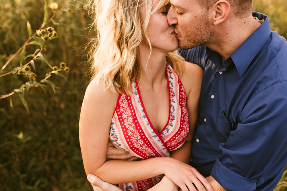 couple kissing at sunset at eagle marsh nature preserve engagement session