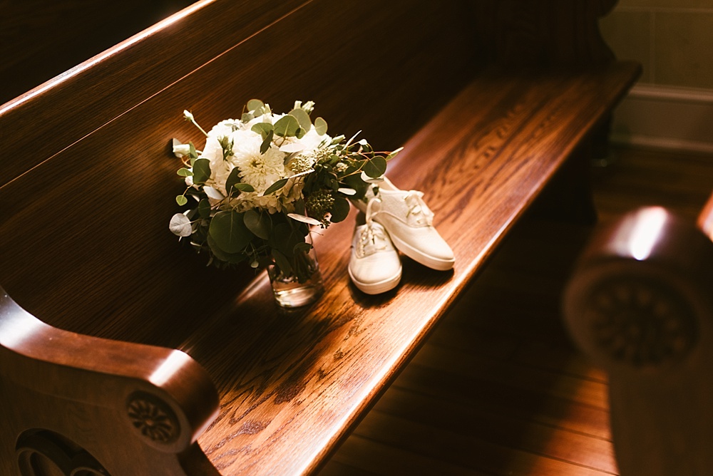wedding shoes and bouquet at precious blood catholic church wedding