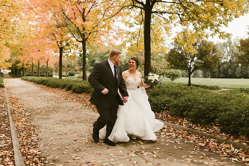 bride and groom laughing at headwaters park fall wedding