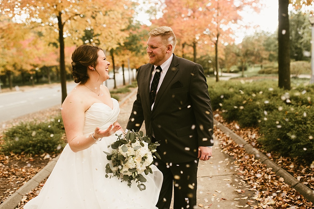 bride and groom smiling at headwaters park fall wedding