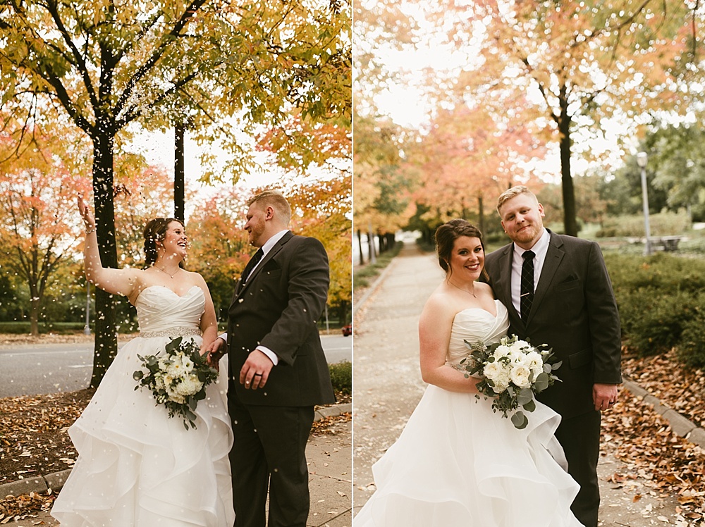 couple smiling at each other at headwaters park fall wedding