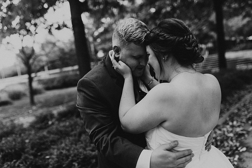 bride and groom hugging at headwaters park fall wedding