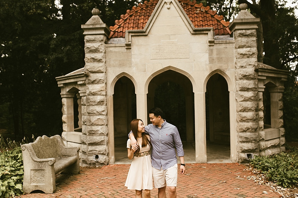 couple hugging in front of observatory at indiana university bloomington engagement session