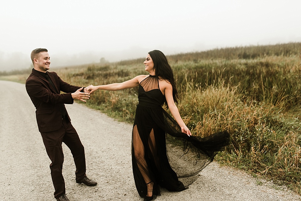 couple dancing by field at sunrise eagle marsh engagement session