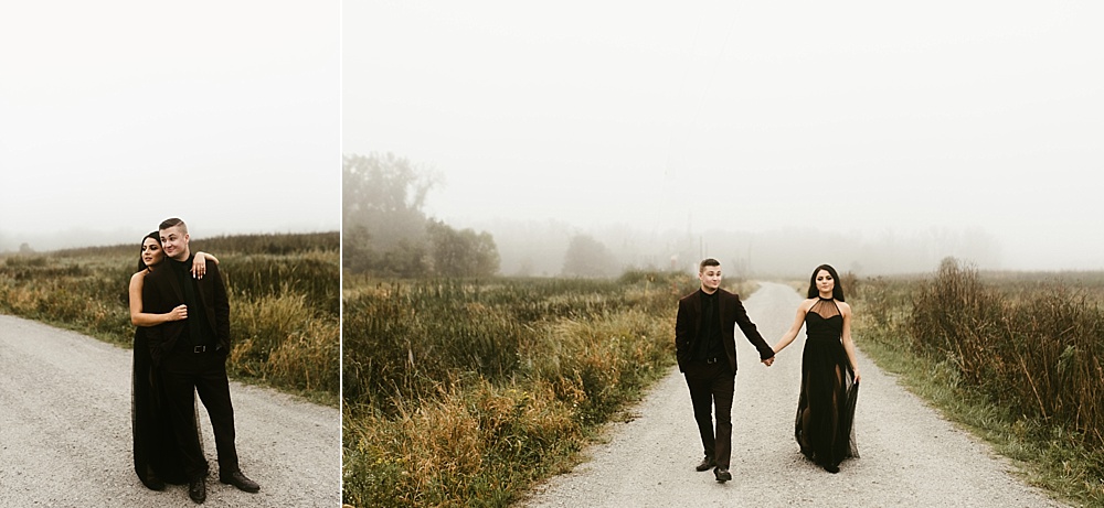 couple hugging and holding hands next to field at sunrise eagle marsh engagement session