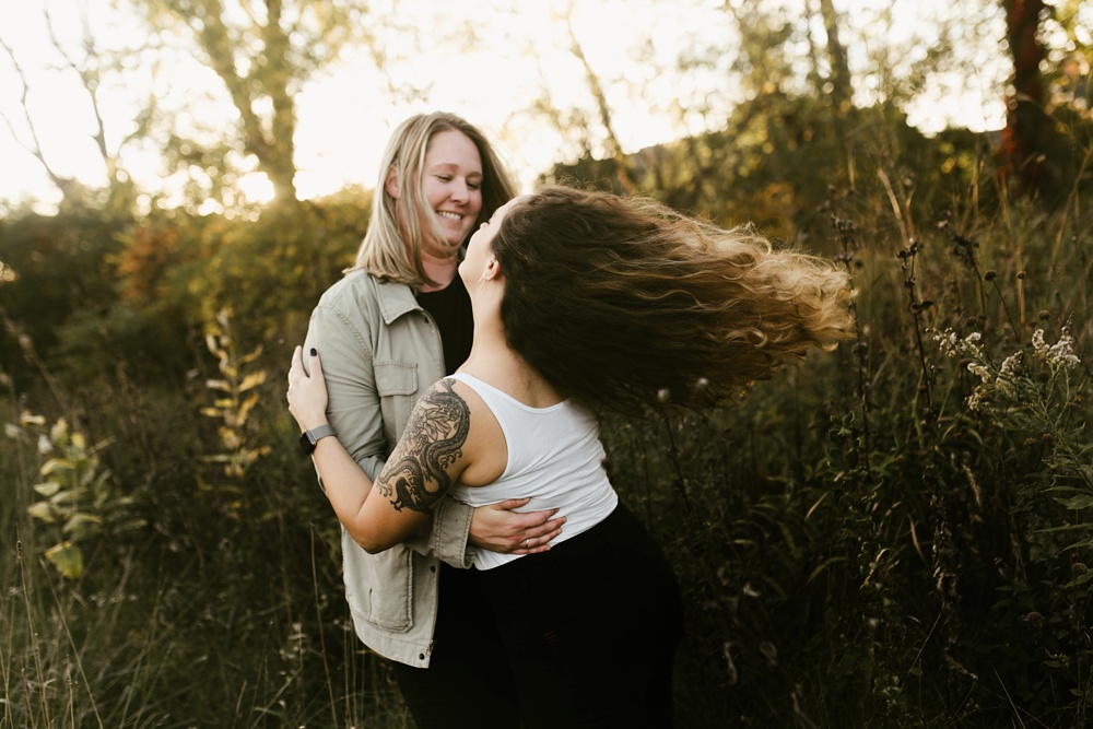 couple dancing at sunset at coffee creek watershed preserve engagement session