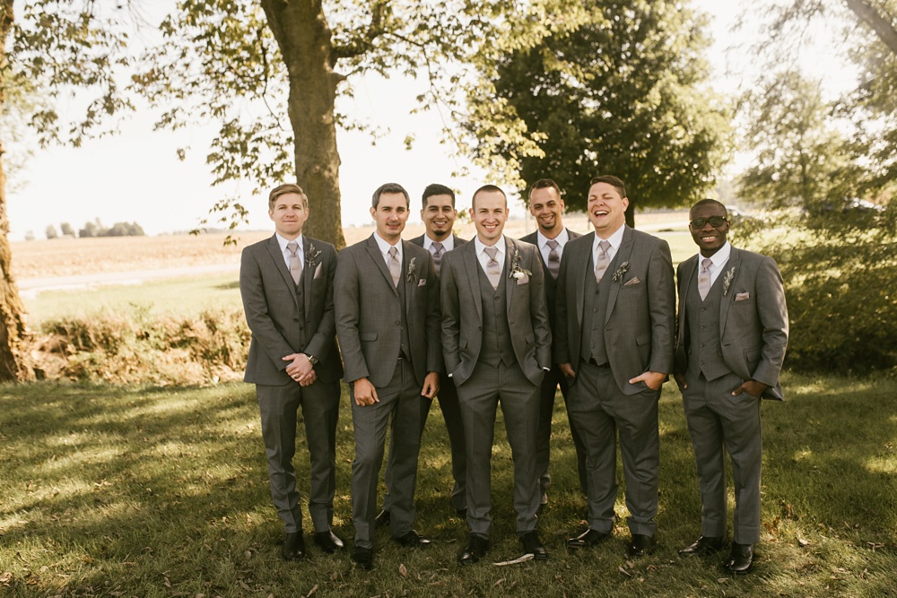 groomsmen in gray tuxes at indiana wesleyan fairmount campground wedding