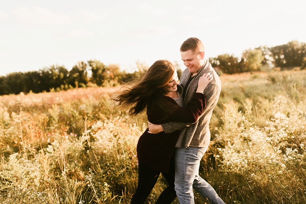 couple dancing in field at golden hour fort wayne autumn engagement session