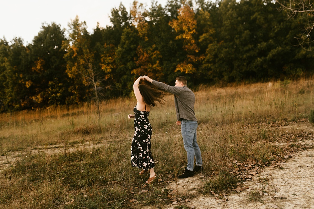 couple dancing in field at golden hour fort wayne autumn engagement session