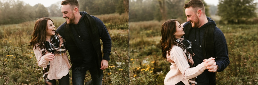 couple hugging in field at auburn sunrise engagement session