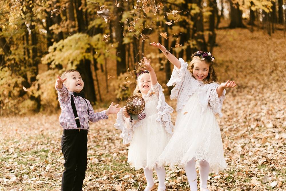 flower girls and ring bearers tossing leaves at green bay pamperin park rock garden wedding