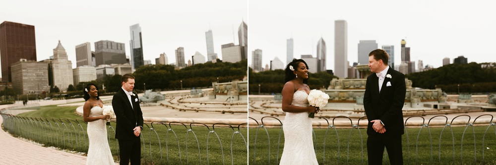 bride approaching groom for first look at buckingham fountain chicago