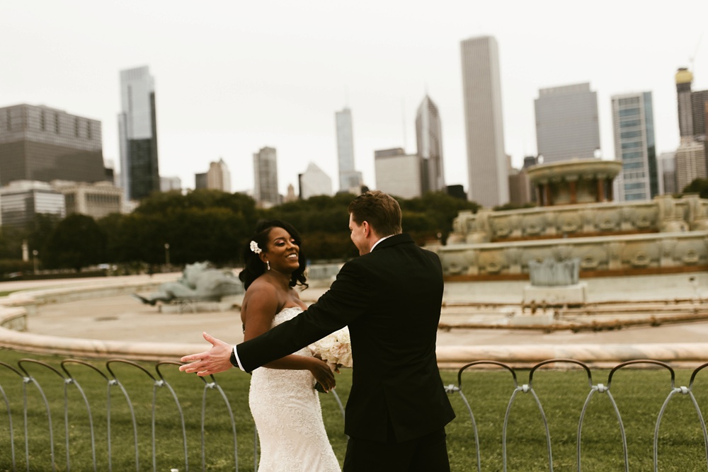 bride and groom first look at buckingham fountain chicago