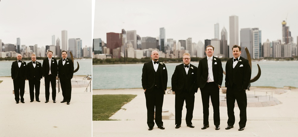 groomsmen in black tuxes at buckingham fountain chicago