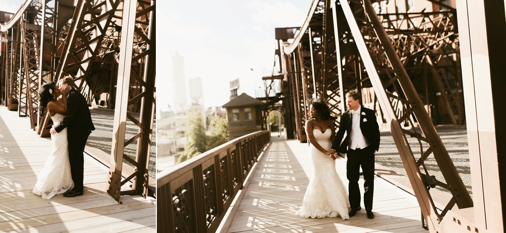 bride and groom holding hands on bridge at chicago wedding