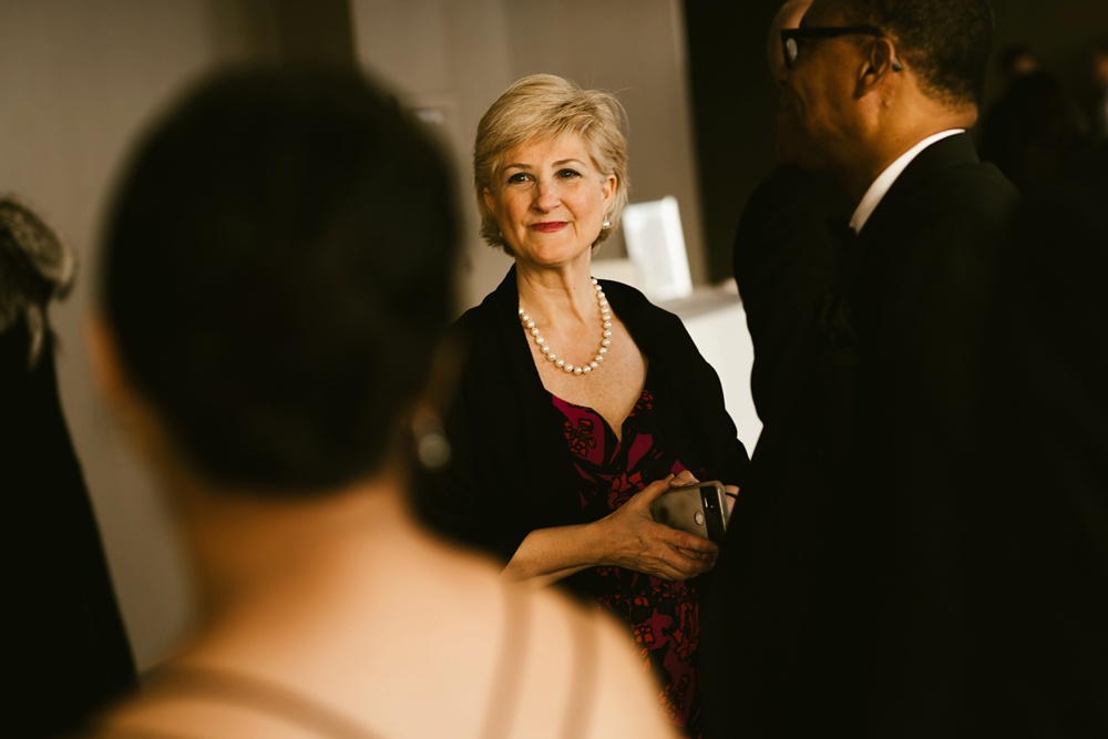 mother of groom smiling before ceremony at skydeck willis tower wedding