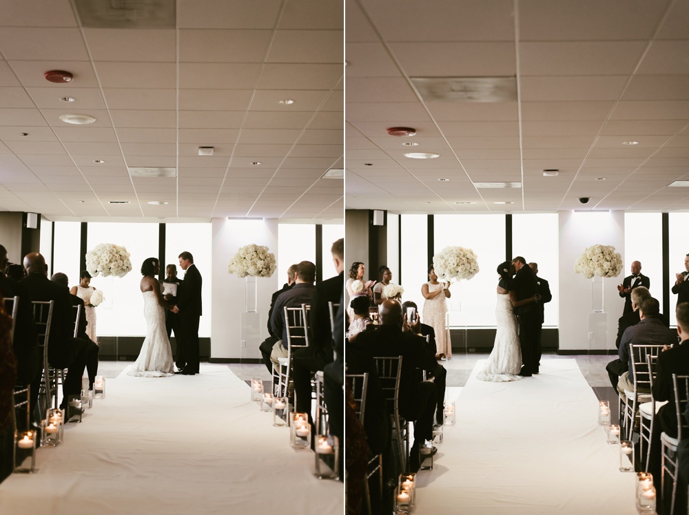 bride and groom kissing during ceremony at skydeck willis tower wedding
