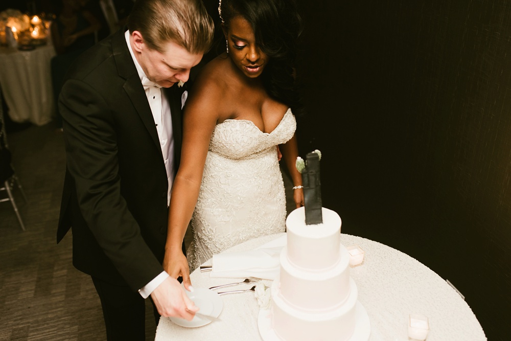 Chicago bride and groom cutting their cake.
