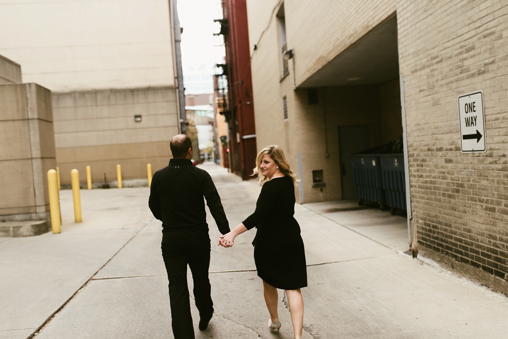 couple holding hands at downtown fort wayne engagement session